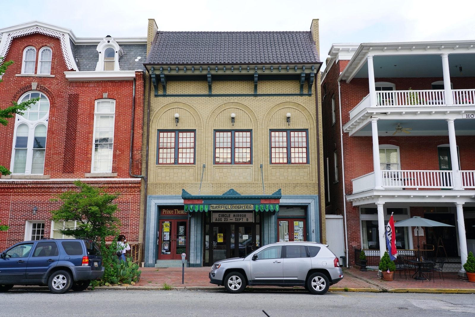 How To Spend the Day in the Chestertown Historic District 1 Cars parked on a street in front of historic buildings in the Chestertown Historic District.