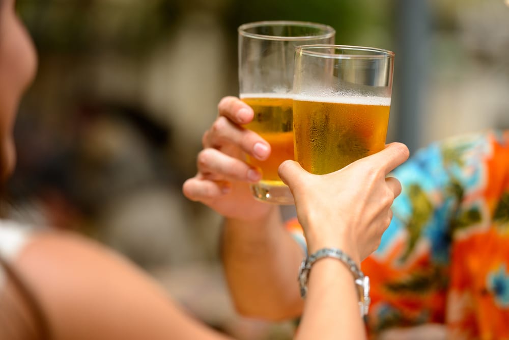 A couple doing a cheers at one of the breweries on the Eastern Shore of Maryland