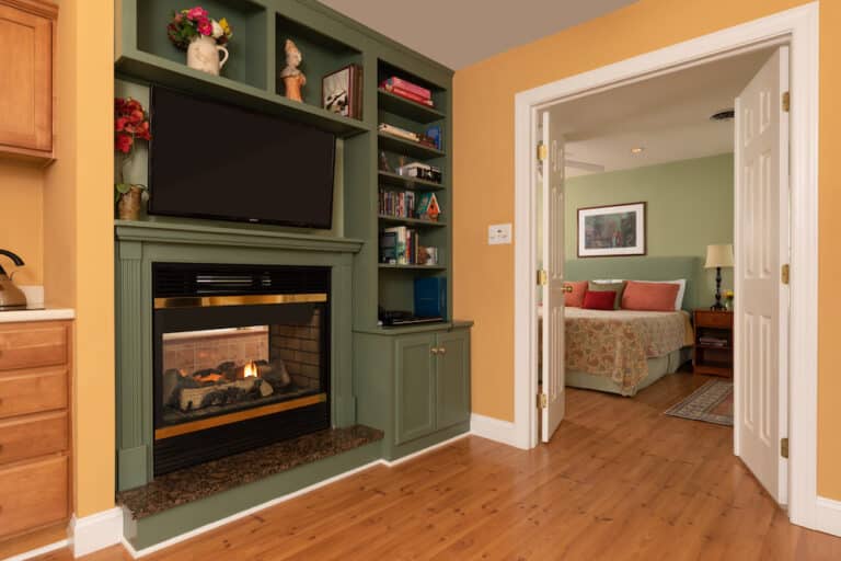 Cozy fireplace and guest room at our Rock Hall Maryland Bed and Breakfast