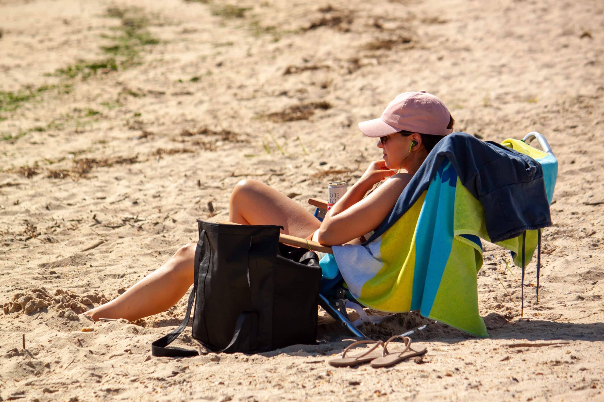 woman sitting at one of the many Chesapeake Bay Beaches near Rock Hall Maryland